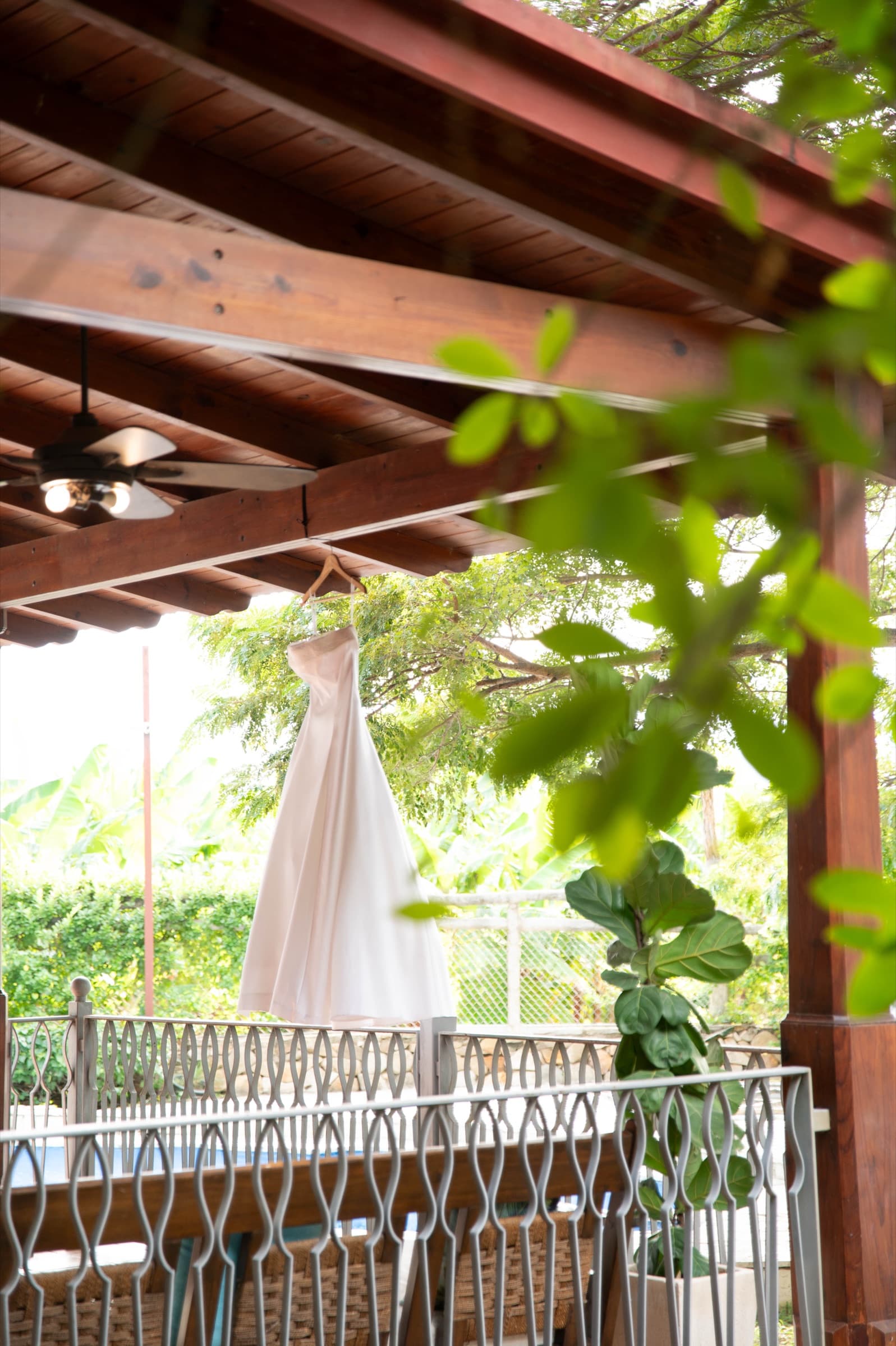 The wedding dress hanging before Zeta & Daniel's ceremony