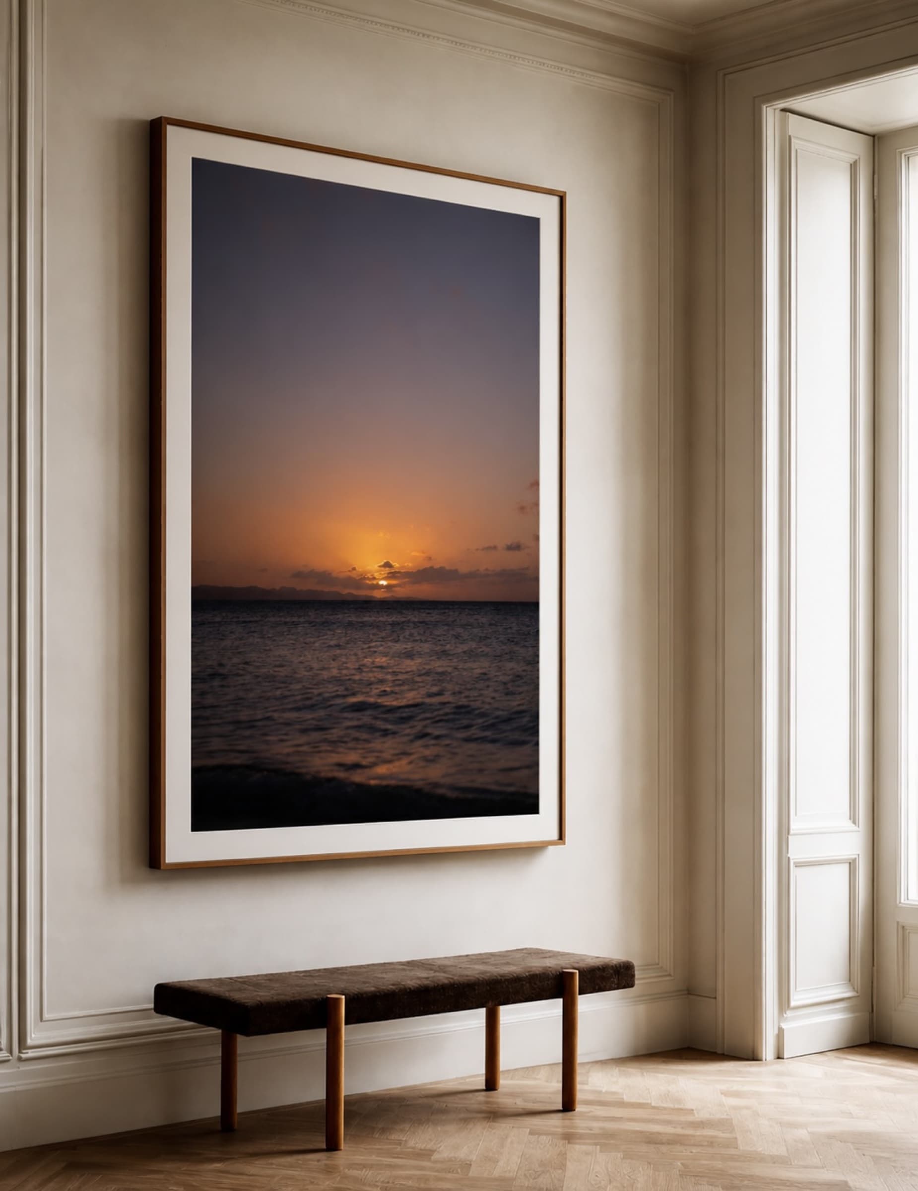 Large framed vertical sunset print in a foyer