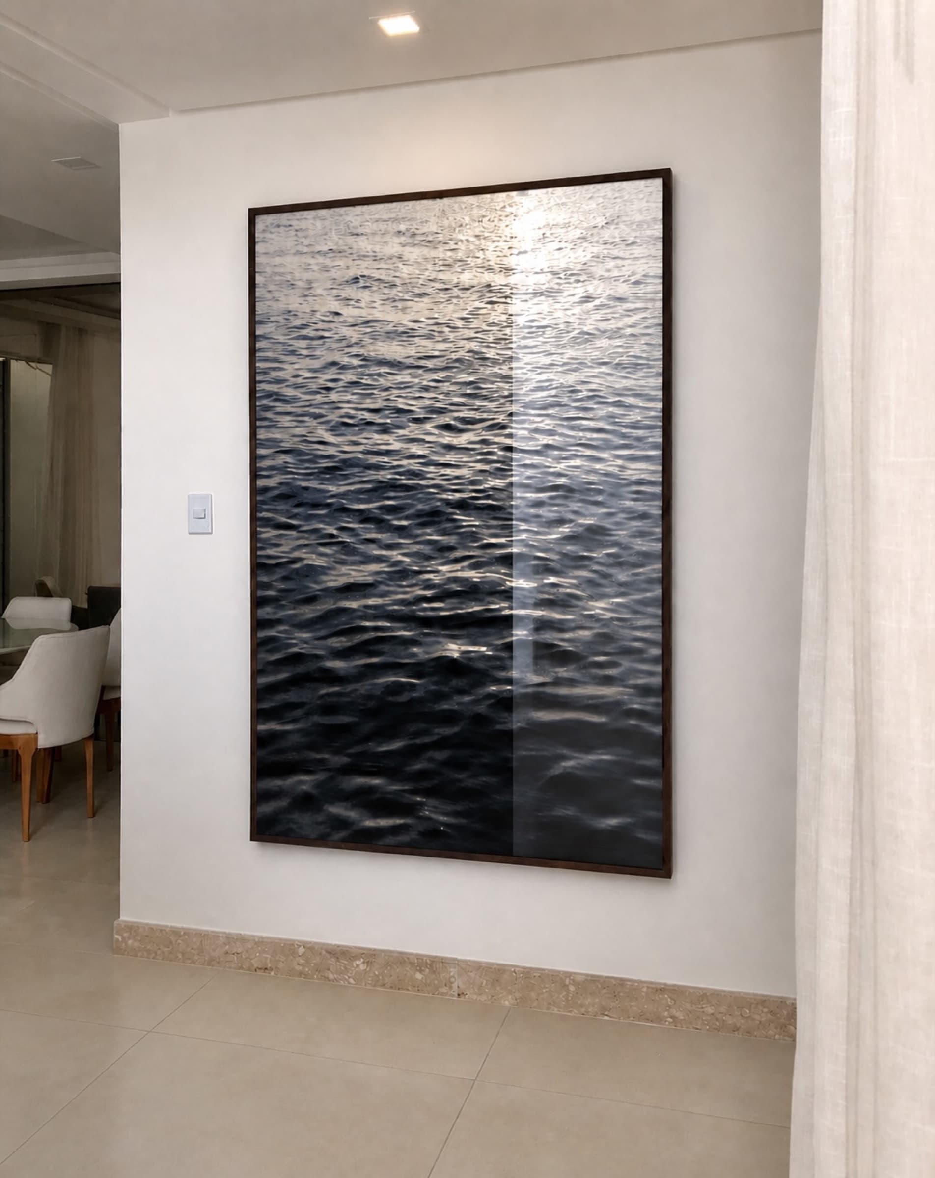 Framed print of rippling water in a hallway
